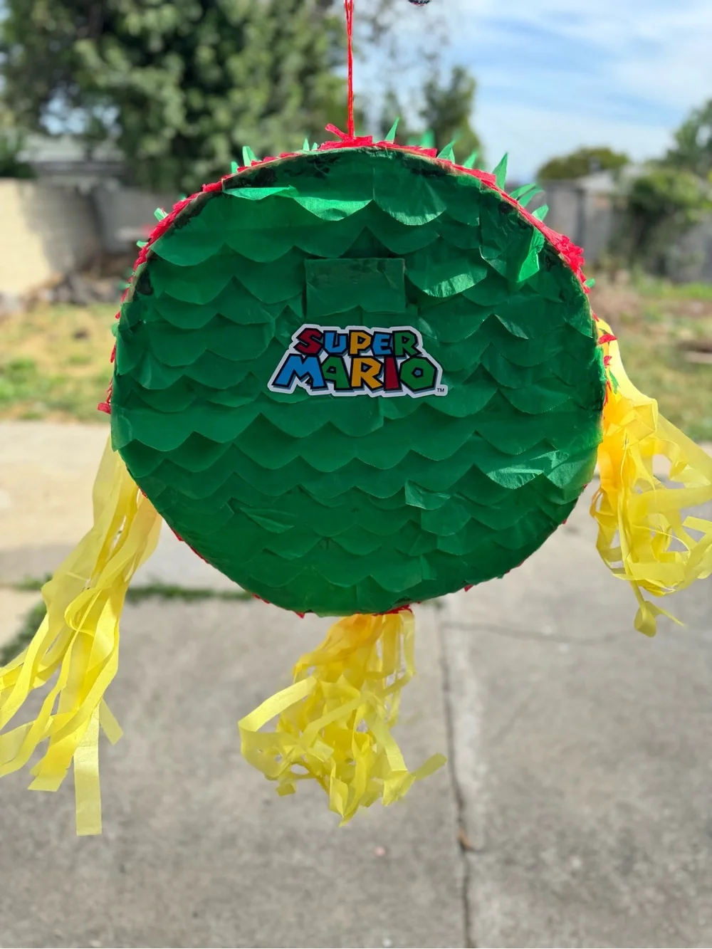 Super Mario Red & Green Party Piñata with Yellow Streamers